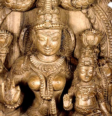 Lakshmi with Her Son Shrikumar in Her Lap - Wood Statuette